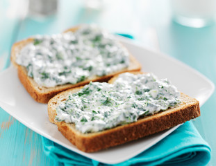 creamy spinach dip spread on toast shot with selective focus 
