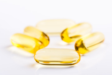 Fish oil in pills on a white background.