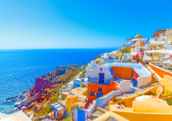 View to the sea from pictorial Oia in Santorini island in Greece - obrazy, fototapety, plakaty