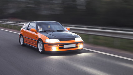 Obraz na płótnie Canvas Orange sport car
