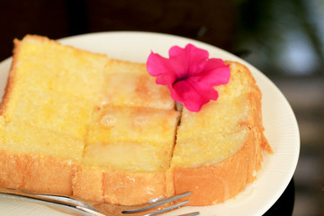 Toast with butter and sprinkling with sugar.