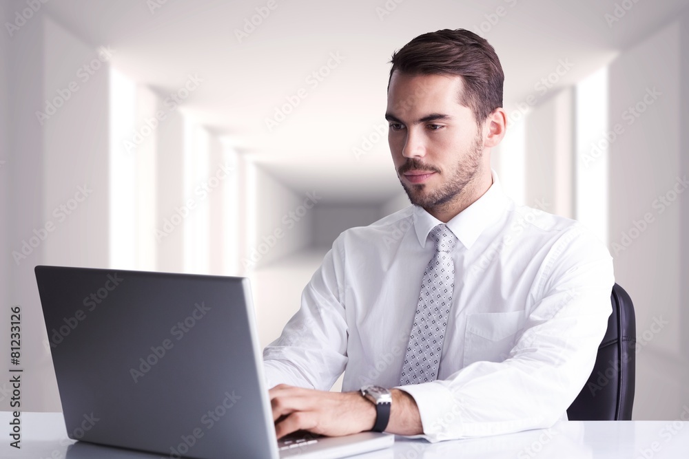 Poster composite image of cheerful businessman using laptop at desk
