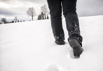 foot steps walking at snow in winter