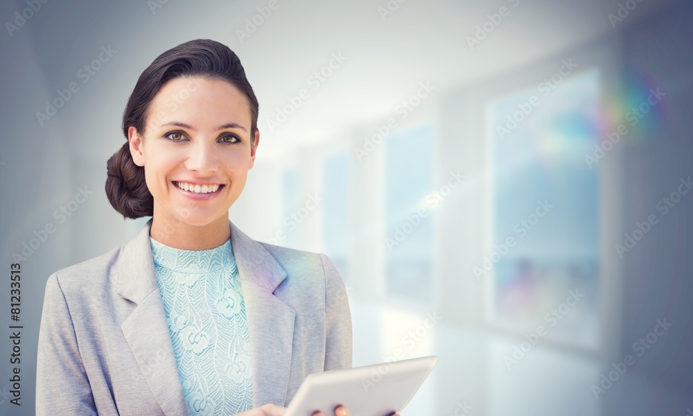 Poster composite image of brunette using tablet pc