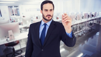 Businessman holding a chalk and writing