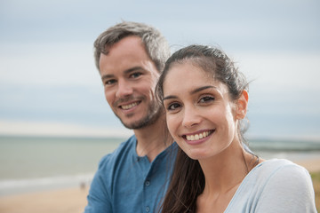 Fototapeta premium Portrait of a beautiful couple at the beach