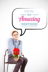 Composite image of geeky hipster holding a bunch of roses