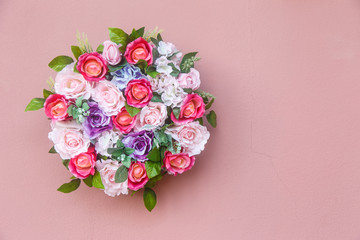 Bouquet of flowers on pink wall