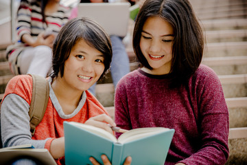 group of happy teen high school students outdoors