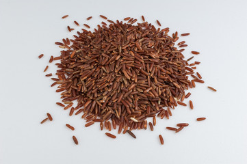 pile of red rice isolated on white