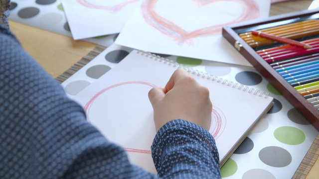 Girl drawing a heart - Valentine’s Day - Mother’s Day
