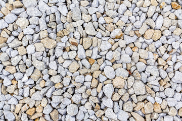 Crushed rock, gravel granite stones close-up.