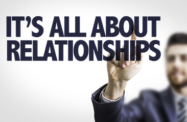 Business man pointing the text: It's All About Relationships