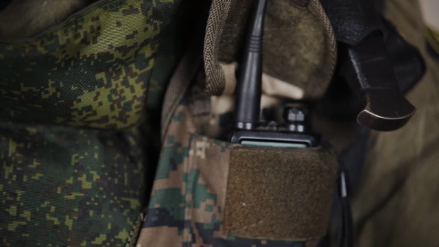 commando puts it in his pocket radio
