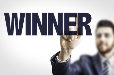 Business man pointing the text: Winner