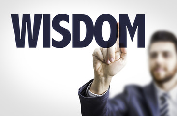 Business man pointing the text: Wisdom