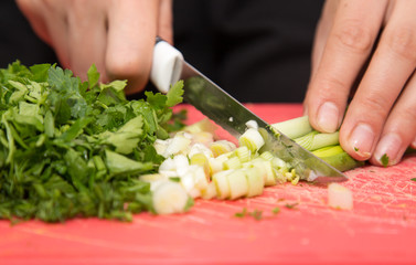 sliced green onions with a knife
