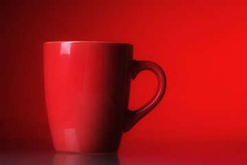 Red cup over red background