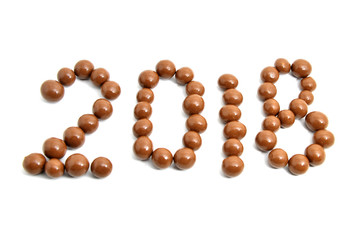  Image 2018 of sweet chocolate round on a white background.