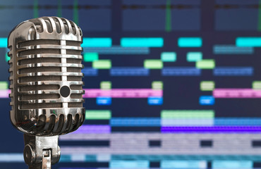 Retro microphone over recording software background.