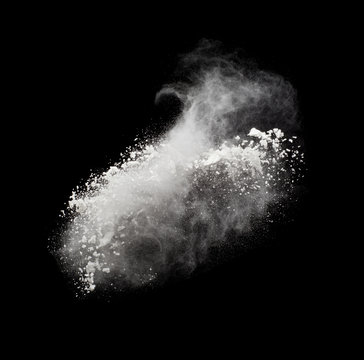 Freeze motion of white powder exploding, isolated on black