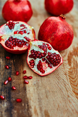 pomegranates on a dark wooden background