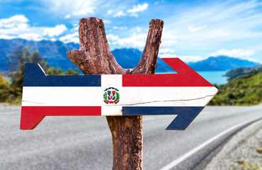 Dominican Republic Flag wooden sign with road background