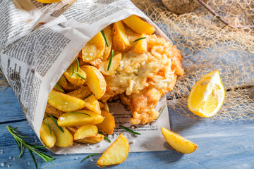 Delicious fish cod with chips with lemon