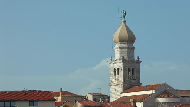 Bell tower and steeple of old town Krk in Croatia