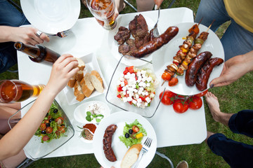 People eating grilled dishes