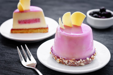 cake with a creamy mousse and stuffed berry mousse