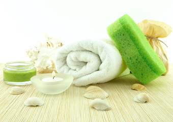 Obraz na płótnie Canvas Spa and wellness setting:towel,sponge,candles and shells.Toned