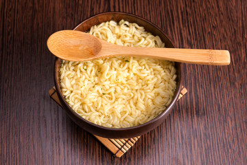 Instant noodles in a wooden bowl