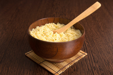 Instant noodles in a wooden bowl