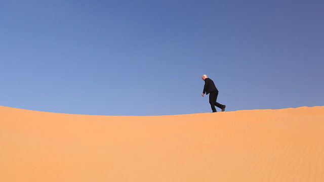 hopeless businessman in desert