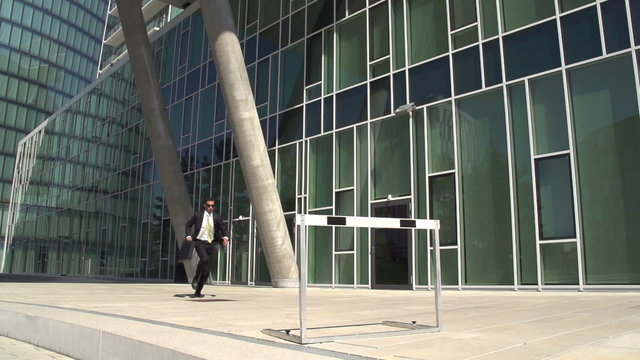 slow motion business hurdler office block