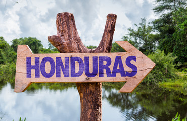 Honduras wooden sign with forest background