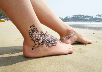 Henna tattoo on the foot. Palolem beach of South Goa, India