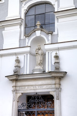 Statue of Virgin Mary. Decoration element of house in old city. 
