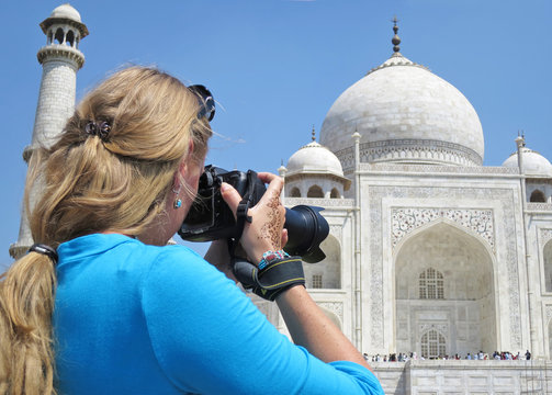 Girl taking a shot of Taj Mahal. Agra, India