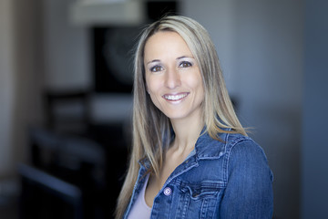 Portrait Of A Pretty Blond Woman Smiling At The Camera