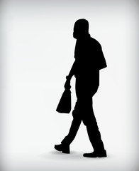 Silhouette of a man walking isolated on a white background