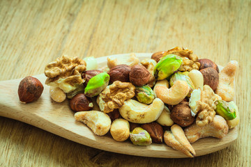 Varieties of nuts: cashew, pistachio, almond.
