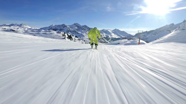following alpine skier