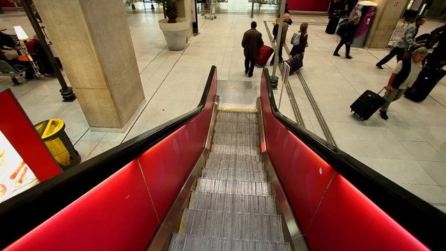 PARIS - OCTOBER 11. Escalator descending to trains in Charles De Gaulle airport on October 11, 2012 in Paris, France. In 2011, the airport handled 60,970,551 passengers and 514,059 aircraft.