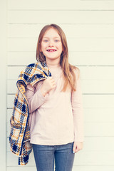 Fashion portrait of a cute little girl of 7 years old