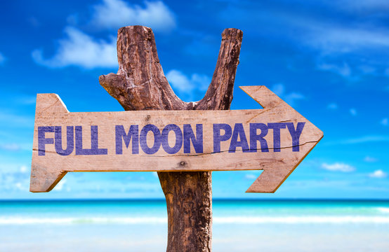 Full Moon Party wooden sign with beach background