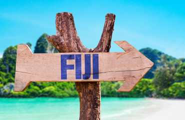 Fiji wooden sign with beach background - obrazy, fototapety, plakaty