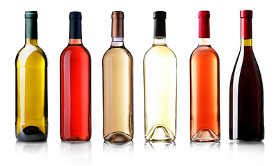 Obraz na płótnie Canvas Wine bottles in row isolated on white