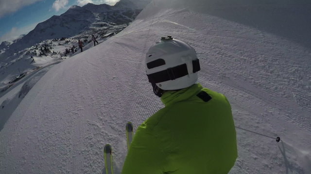 accompany skier skiing on ski slope, special perspective
